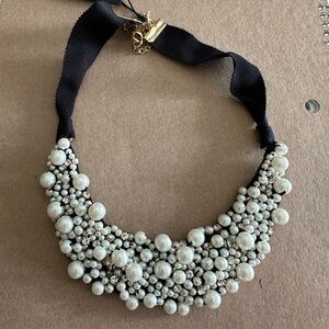 Pearl bib necklace on a black grosgrain ribbon